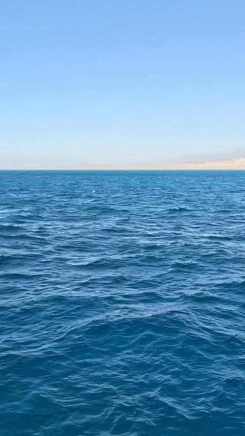 Captivating Views of the Tranquil Ocean Waves Under a Clear Blue Sky: A Stock Footage 331278088