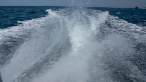 Captivating Wake of a Boat Cutting Through Calm Waters, Showcasing the Dynamic Stock-Footage 317905559
