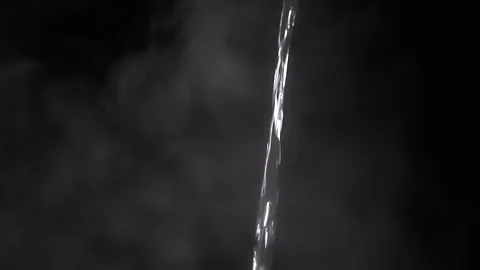 Captivating Water Stream Set Against a Dark and Mysterious Background That Stock-Footage 312014119