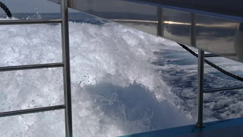 Captivating Waves Elegantly Seen While on a Boat Journeying Across the Open Vast Stock Footage 313872177