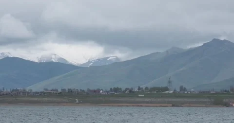 Capture the enchanting vista of Sevan Mountain Lake, where the ethereal clouds Видео 252466402