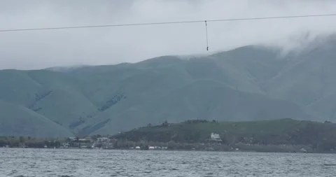 Capture the mesmerizing view of the stunning Sevan Mountain Lake, where the Видео 252467781