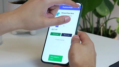 Capture the relatable online shopping experience. A hand adds a polo shirt to a Stock Footage 315305982