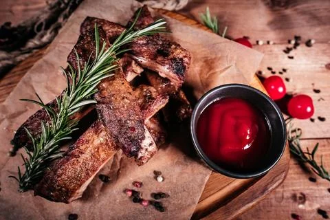 Capture the rustic charm with these aromatic grilled ribs delicately placed o Stock Photos