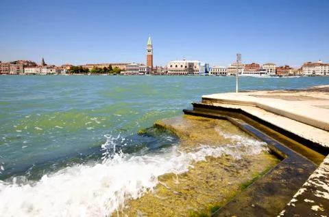 Capture the stunning low angle view of Venice promenade from San Maggiore island Stock Photos
