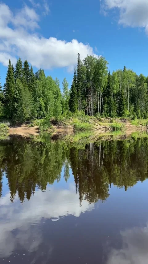 Capture stunning white clouds, blue skies, green forests and river. Summer Adven Stock Footage 282572247