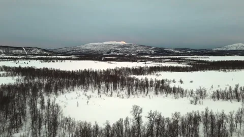 Captured by a drone, this aerial video showcases a striking winter landscape in Stock Footage 330376586