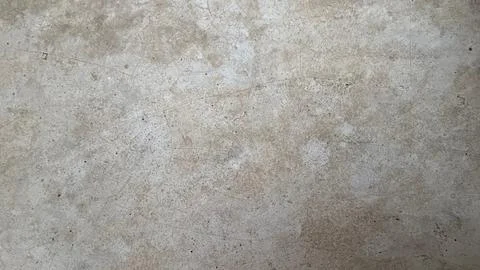 Captured is a full-frame, close-up view of an aged, textured surface exhibiti Stockfoto's