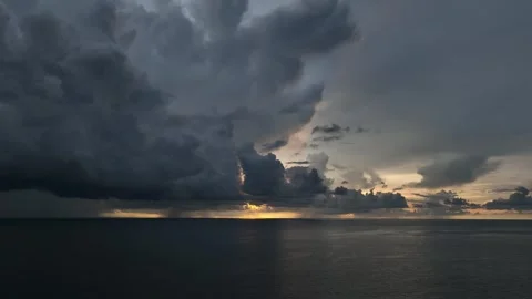 Captured from the sky, dark clouds loom over the ocean. Stock Footage 307774931