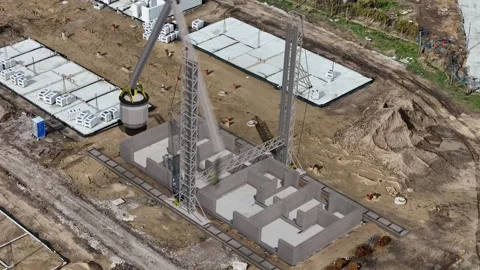 Captured in time-lapse, a large 3D printer steadily layers concrete, formin.. Stock Footage 252575006