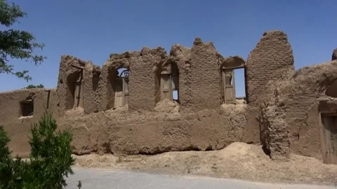A captures a mud ruined house with no rooftop destroyed, stock footage. Stock Footage 304796243