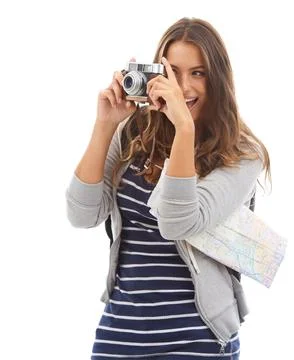 Capturing all the sights. A pretty young tourist taking pictures while isolated Photos
