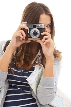 Capturing all the sights. A pretty young tourist taking pictures while isolated Photos