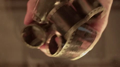 Capturing the art of developing film from a low angle perspective Video stock 319965901