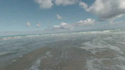 Capturing Bali's Dynamic Coastline: Action Footage of Indonesia's Rolling Waves Stock Footage 269421444