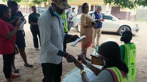 Capturing during Election Day by Inec official Stock Footage 331424649