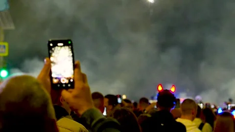 Capturing fireworks on a smartphone. Stock Footage 341110057