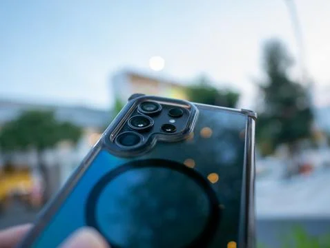 Capturing the future smartphone showcase urban setting evening close-up tec.. Stock Photos