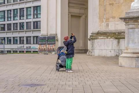 Capturing history curious tourists snap photos of historical buildings Stock Photos