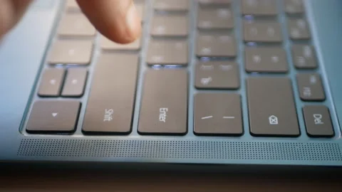 Capturing a long press on the enter key on a laptop keyboard. Stock Footage 197874610
