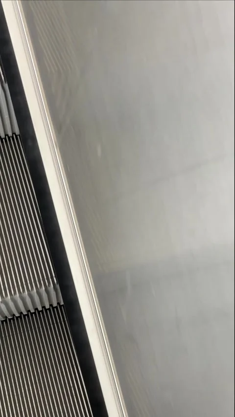 Capturing mechanical grooves and safety markings on escalator Stock Footage 347332001