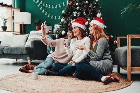 Capturing memories. three attractive middle aged women taking self portraits Stock Photos