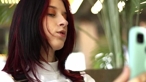 Capturing the moment in a vibrant urban setting with a touch of style Stock Footage 295269319