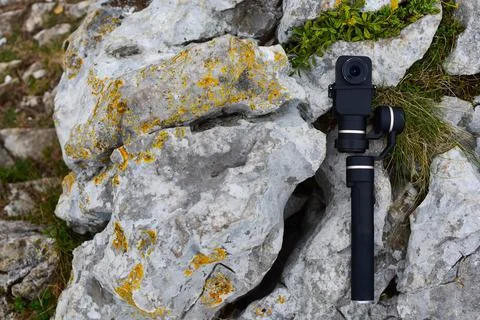Capturing Nature's Symphony: Action Camera Gimbal Amidst Gray Rocks Stock Photos