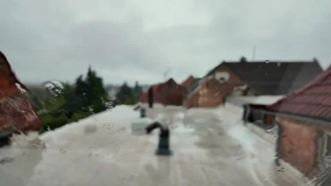Capturing a Rainy Day on a Rooftop in a Quiet Neighborhood During Fall Video stock 288005433