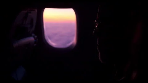 Capturing the serene moment by the airplane window during sunset travel Stock Footage 312700082