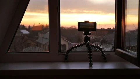 Capturing the sunrise with a cell phone camera.Shooting travel video on mobile Stock Footage 229983461