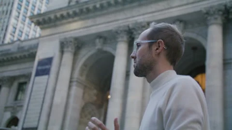 Capturing urban life with a camera on NYC streets in evening light Stock Footage 312588072