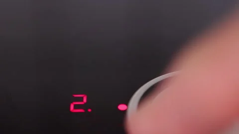 Capturing the vibrant glow of a focused laser pointer on a dark surface during a Stock Footage 281597366
