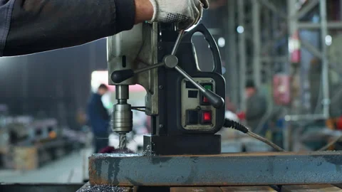 Capturing video closeup in the manufacture blacksmith make holes in the metal Stock Footage 259899648
