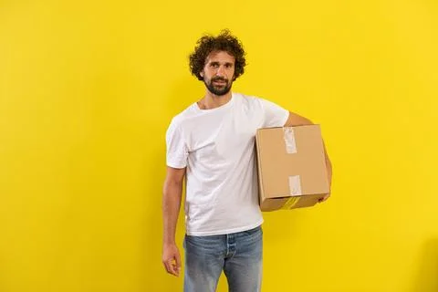 Capturing video inside the box good looking guy open the box and take personal Stock Photos
