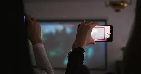 Capturing visual presentation with smartphone, showcasing modern digital tools Stock Footage 296326393