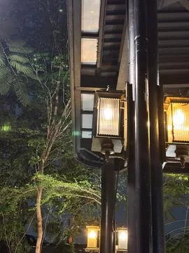 Capturing the warm glow of traditional, lantern-style outdoor lights Stock Photos