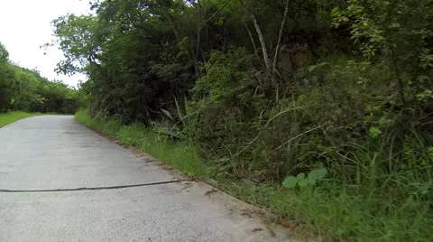Car about to go over drain in the road Video stock 41440307