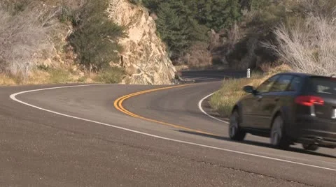 Car accelerates through mountain curve. Video stock 8882493