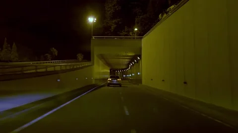 Car accessing the high way trough a tunnel at night Video stock 53004678