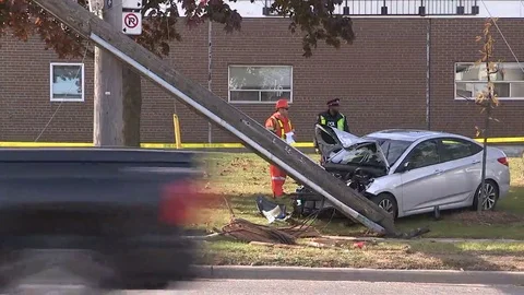 Car accident with car crashed into hydro pole Stock Footage 69122368