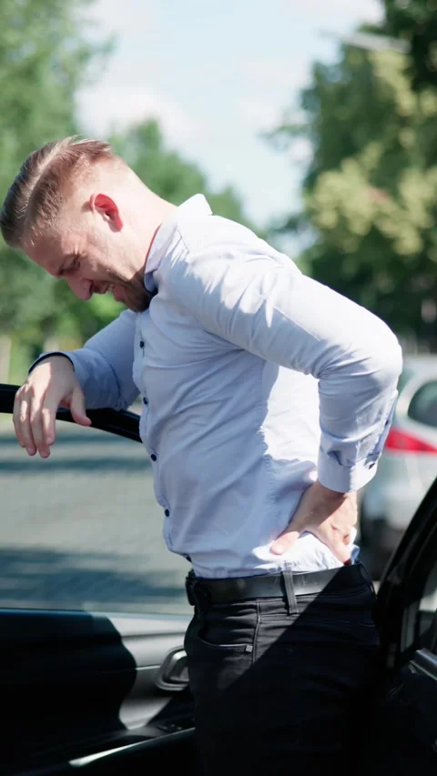 Car Accident Causes Driver Excruciating Back Pain Stock Footage 314129702