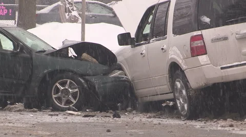 Car accident crash in winter snow storm in very cold weather Stock Footage