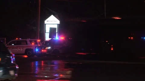 Car accident in dark city intersection with police and at scene at night Stock Footage 81825228