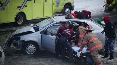 Car Accident during the winter at an intersection Stock Footage