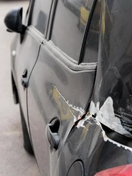 Car accident, left side view of crashed car waiting insurance expert for repa Stock Photos