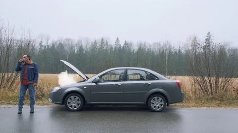 Car accident on the road. Man calling by phone about breakdown. Emergency stop Stock Footage 144673067