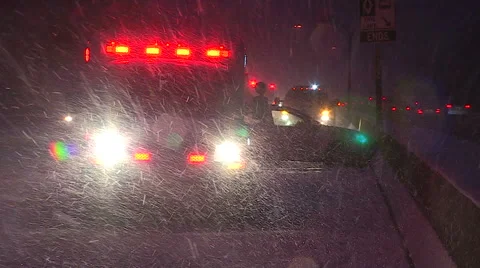 Car accident scene in blizzard and snowstorm with police fire ambulance Stock Footage 56293408