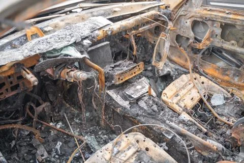 Car after deliberate arson. destroyed vehicle after a fire melted is on the Foto stock