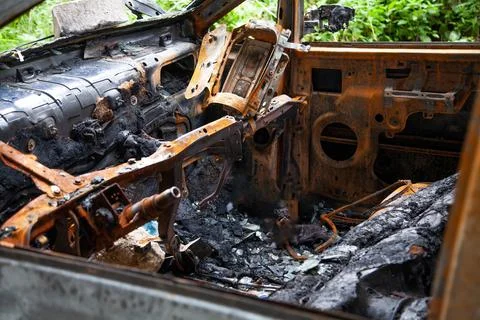 Car after a fire. Burnt rusty car after fire or accident. Car after the fire Stock Photos